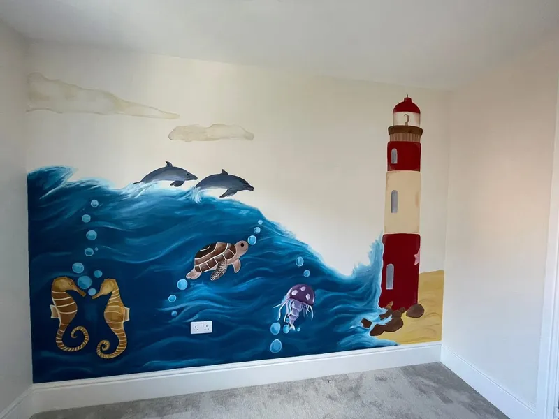 Bedroom wall mural of a deep blue wave with dolphins, sea creatures and a lighthouse.
